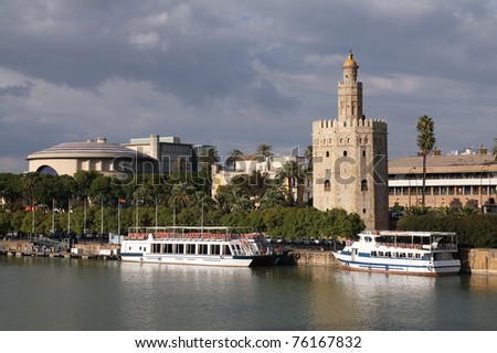 Seville, Spain - river Guadalquivir view with famous Golden Tower (Torre del Oro).