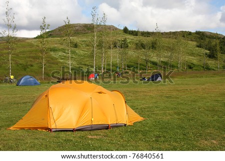 Campsite tents in Geysir - famous tourist area in Iceland. Summer camping.