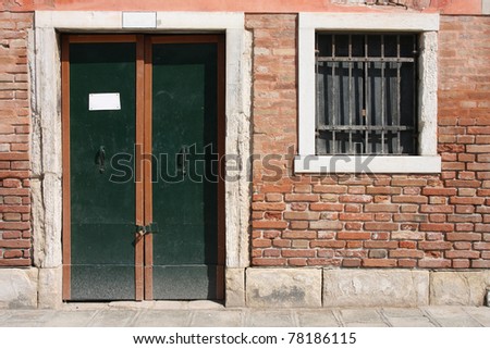 Old door and window in Venice, Italy. Vintage architecture.