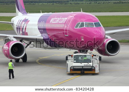 KATOWICE - MAY 29: Wizzair Airbus A320 pushed back on May 29, 2010 at Katowice Airport, Poland. With 37 A320 in fleet and 123 more on order Wizzair is among top Airbus customers (as of August 2011).