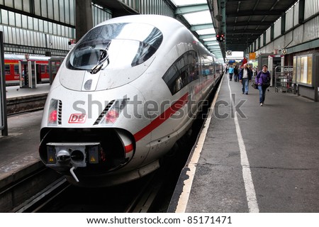 STUTTGART, GERMANY - JULY 24: Intercity Express (ICE) train of Deutsche Bahn on July 24, 2010 in Stuttgart, Germany. DB took over Arriva company in August 2010. ICE 3 class train produced by Siemens