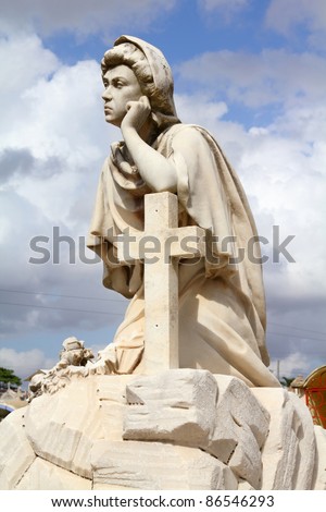 Cuba - sad statue in the cemetery of Camaguey.