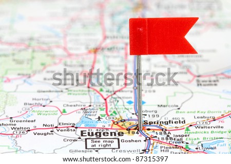 Eugene, Oregon. Red flag pin in an old map showing travel destination.