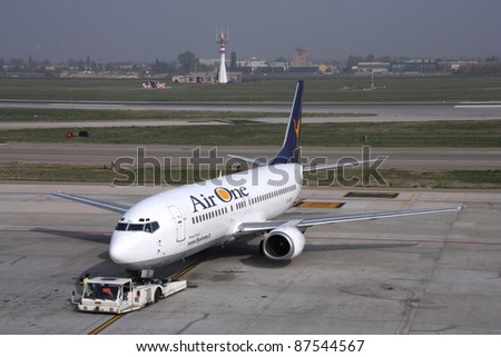 BOLOGNA, ITALY - OCTOBER 29: Boeing 737 of Air One on October 29, 2009 at Bologna Airport, Italy. Boeing 737 Classic is one of the most popular commercial aircraft ever (1998 units built).
