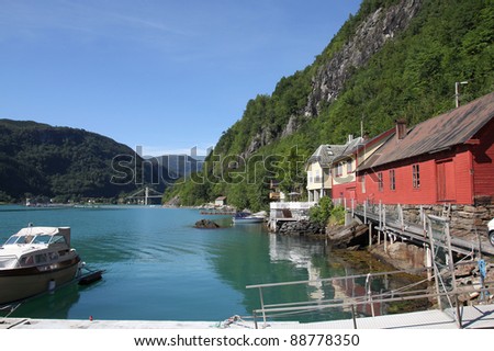 Norway - Hardanger fjord marina with anchored motorboats. Seaside landscape.
