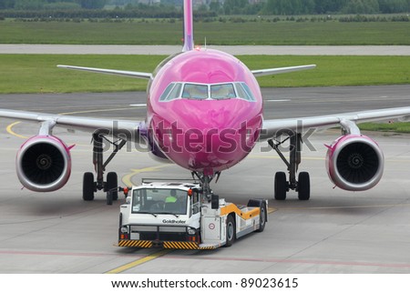 KATOWICE, POLAND - MAY 29: Wizzair Airbus A320 pushed back on May 29, 2010 at Katowice Airport, Poland. With 37 A320 in fleet and 123 more on order Wizzair is among top Airbus clients (as of Nov 2011)