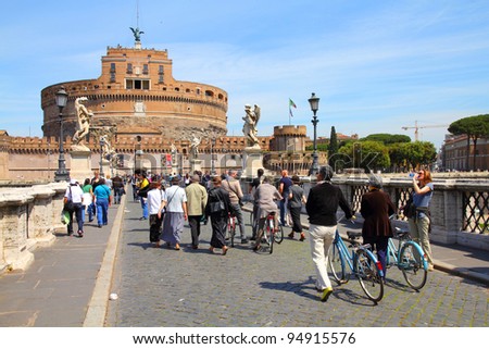 ROME - MAY 9: Tourists walk along Saint Angel Bridge on May 9, 2010 in Rome. Rome is 14th most visited cities in the world (5.6m international arrivals in 2010).