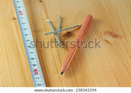 Do it yourself Tape measure with a pencil and brads