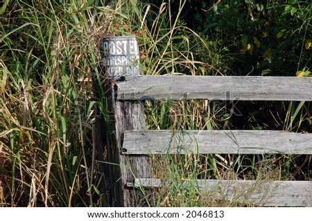 Fence post with sign