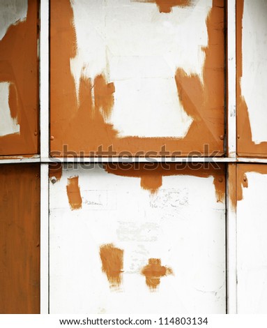 Orange and white metallic background, detail of a painted metal wall
