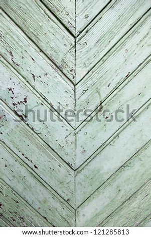 Green wood background, detail of green door, texture
