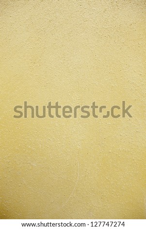 Yellow texture background, detail of yellow wall in the city, urban decoration