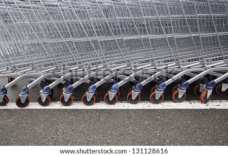 Shopping carts in a supermarket, detail of metal carts in a supermarket, order to make the purchase