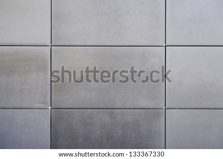 Metal wall tiles, wall detail a facade in the city, modern constrution