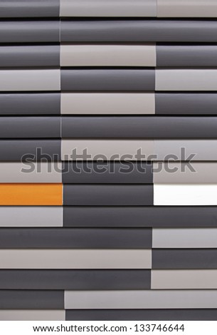Facade tiles in the city, detail of a wall in a modern building, modern architecture, background with texture