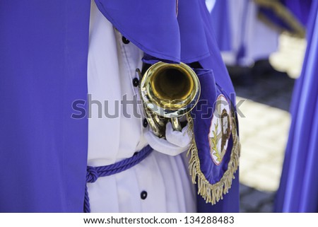 Trumpeter Easter, detail of a person who plays the trumpet in the group of religious music