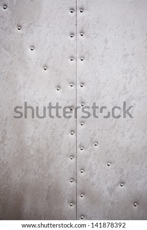 Metal wall texture, detail of a wall with rivets metal background with texture
