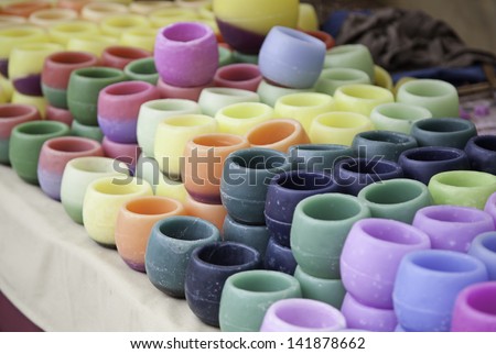 Colored candles, handmade candles detail in a market in the city, artisan product