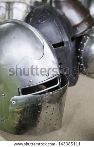 Old war helmet, detail of a medieval armor, war and destruction