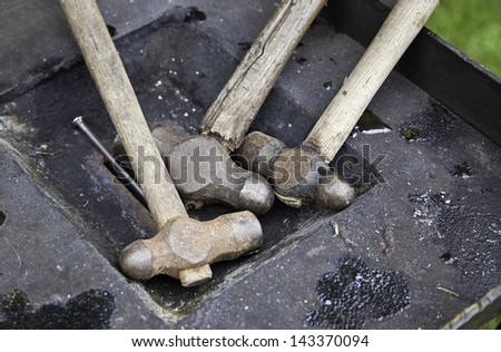 Steel Hammers, detail of a metal forging hammers, anvil, medieval tool