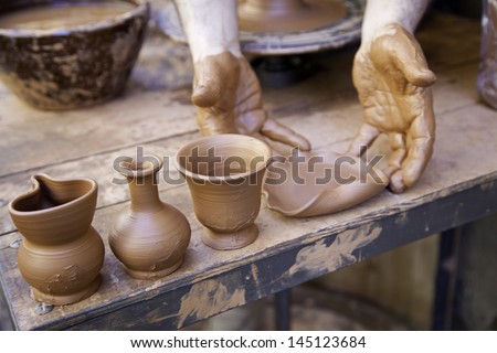 Clay worker, craftsman detail of a street worker, potter