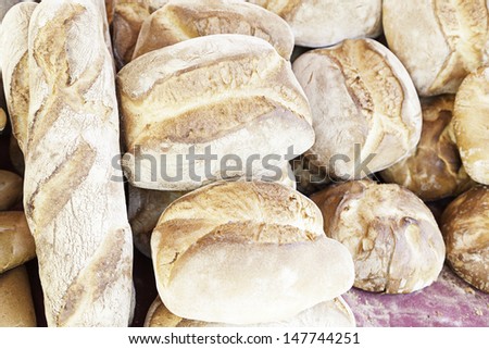 Traditional breads, detail of different types of bread in a position in a Spanish market