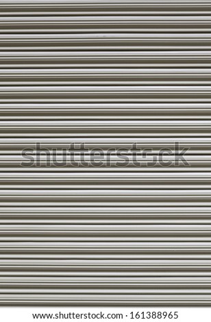 Metallic background of a doorway, detail of a metal door in a house, closed and protection and security