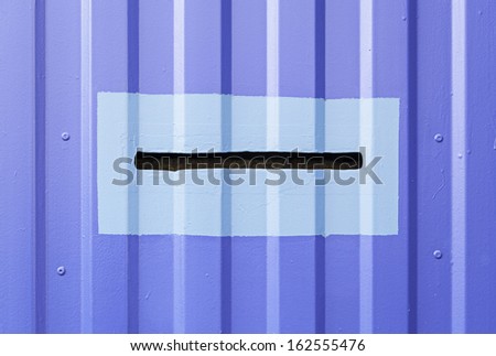 Blue Mailbox door, detail of a metal door on the street, slot cards