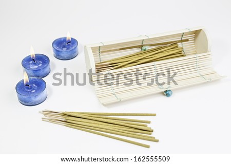 Candles with oriental incense, detail of spa and relaxation, ancient oriental art