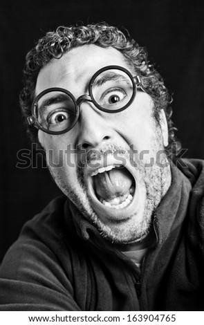 Adult man yelling, detail of a person expressing feelings and emotions, fear and terror