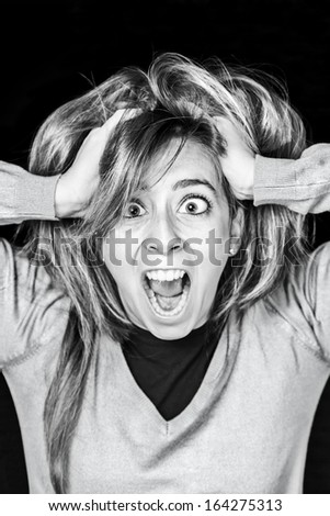 Crazy young woman screaming, detail of an attractive young and sexy screaming, expression and feelings