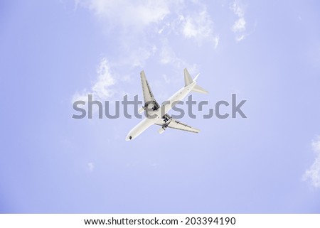 Cargo aircraft in flight, is isolated on a blue background