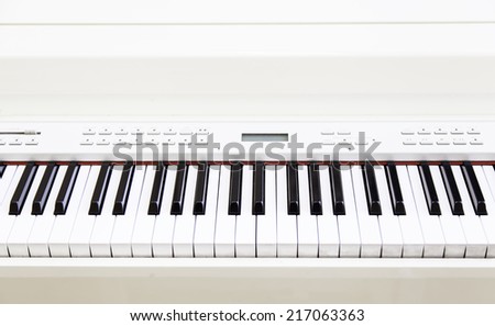 White piano on stage, detail musial instrument of classical music