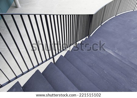 Black cement staircase, detail of a staircase on the outside of a house