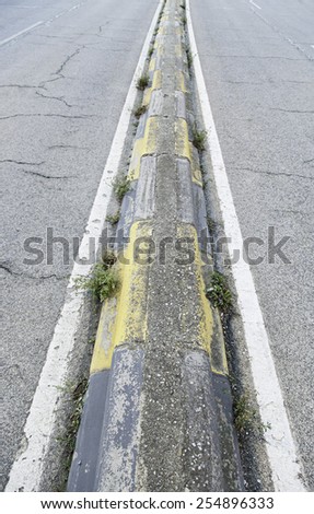 Separation of cement on a road security detail on a road