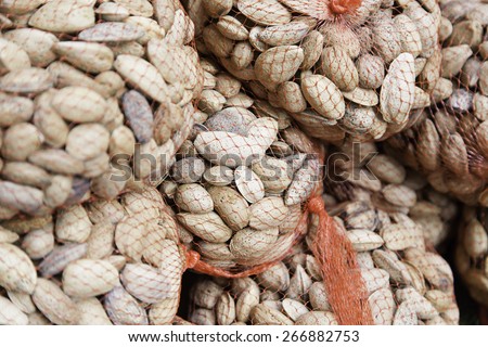 Raw almonds in shell, detail of a traditional market
