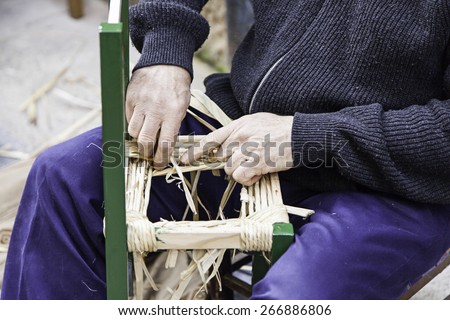 Craftsman wicker person working with his hands, arts and crafts
