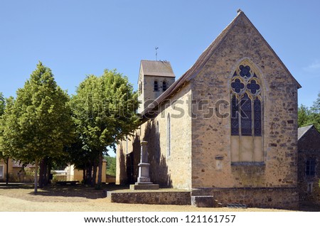 Church Saint Hilaire and tilia trees at AsniÃ?Â¨res sur VÃ?gre, commune of the Pays de la Loire region in north-western France