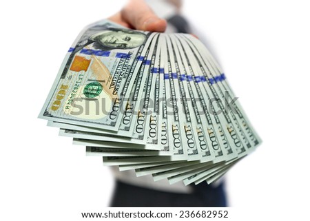 man holding a a stack of money in hand