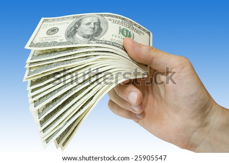 money (doolar) in hand over blue background