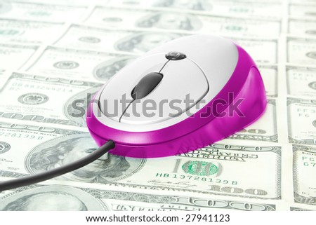 business concept. pink computer mouse on dollars