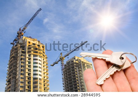 real estate concept. the key with the fingers