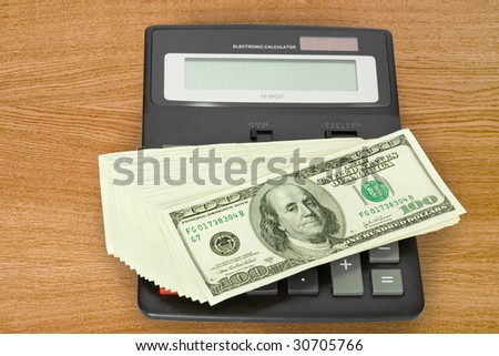 finance and business concepts. money with electronic calculator