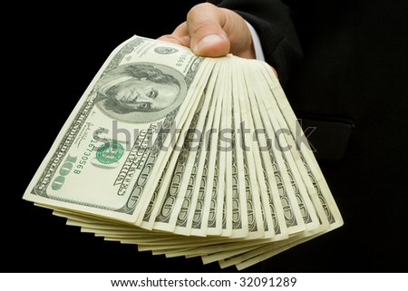 finance. money in hands isolated on black