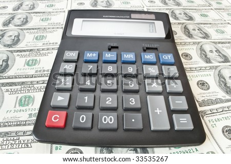 The electronic calculator is on money background