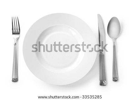 kitchen knife and fork. stock photo : plate with kitchen utensils. fork, knife and spoon