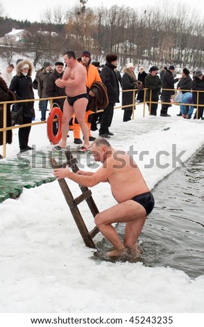 VINNITSA - JANUARY 19: Annual performance of fans of winter swimming on city lake. The organizer - club \