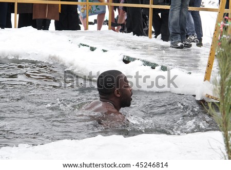 VINNITSA - JANUARY 19: Annual performance of fans of winter swimming on city lake. The organizer - club \