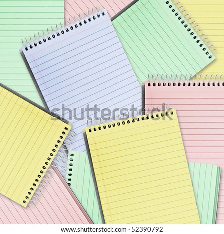 background. a lot of color paper spiral notebooks