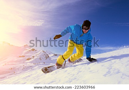 Young man snowboarding.